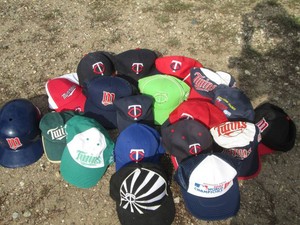Collection of MN Twins baseball caps and hats