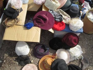 Wide variety of mostly womens hats, berets, fedoras and headware