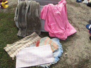 Vintage ladies house coat, fur style long coat, various entry rugs and Rubbermaid roughtote