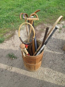 Vintage coffee barrel with assorted walking Canes, baseball bats and more
