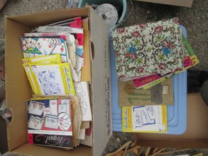 Box of vintage sewing patterns and iron-on transfers