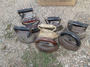 Collection of cast iron and assorted metal sad irons