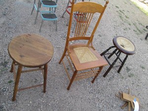 Trio of wood stools and wicker seat dining chair