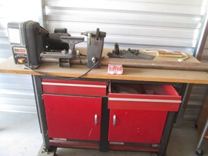 Sears Craftsman spindle speed 12in wood lathe with copy crafter, rolling work bench cabinet and accessories shown in pics