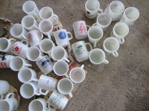 Huge variety of vintage fire king advertisement mugs
