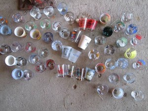 Large collection of assorted shot glasses