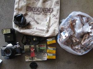 Vintage Canon AE-1 35mm camera 2ith flash, film and other misc