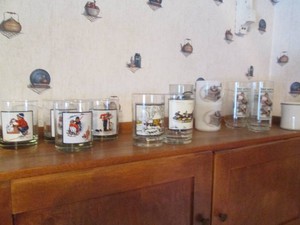Variety of Norman Rockwell themed glassware