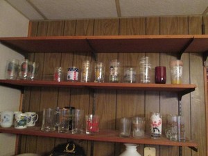 Variety of assorted vintage glassware cups and mugs