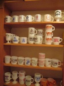 Huge variety of fire king mugs with assorted advertisements