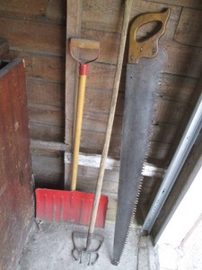 Vintage 4- foot hand saw, vintage edger and snow shovel