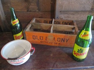 Vintage wood advertisement beverage tray, green glass Squirt bottles and Federal Vogue enamelware