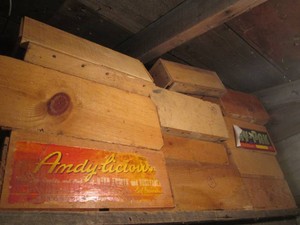 Collection of assorted wood advertisement fruit boxes