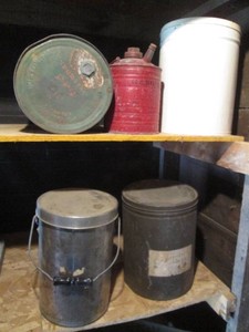 Vintage metal gas can and lidded tins