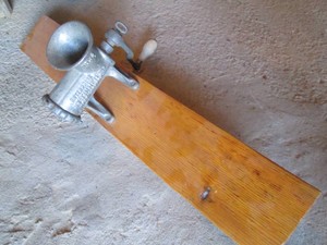 Vintage metal enterprise tinned meat Chopper no. 12 on wood plank