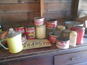 Collection of assorted vintage coffee tins, enamelware percolators, powder tin, pail and license plates