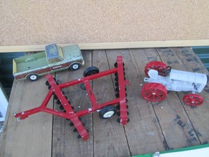 Ertl die cast replica disc plow and puck up with unmarked heavy metal tractor