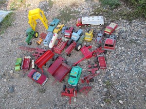Ertl and assorted brand die cast replica tractors, farm implements, trucks and more