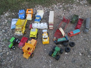 Variety of plastic and die cast replica trucks, semis, tractors and more