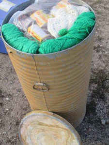 Tall Metal barrel full of assorted yarn