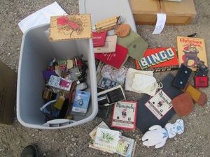 Vintage Bingo and Monopoly games, greeting card variety, mens wallets, banker bags, Harley Davidson cigarette and lighter case plus other goodies in covered tote