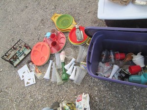 Brownton schools Stamp rack with stampers, plastic compartmentalized food trays, plate holders and cups, vintage glass vases, tankard, planters and more in a covered tote
