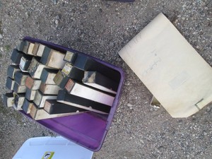 Wide variety of player piano music rolls in covered tote