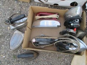 Vintage electric steam irons and sad irons