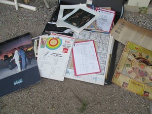 Large zip portfolio with a wide variety of vintage local sports schedules, mixology posters, WWI &WWII uniform prints, posters of the Cassidy brothers, Old Style Beer, Special Export, vintage artwork, blue Prints, atlas, maps and many more