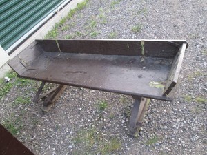 Vintage brown wood wagon seat with metal leaf springs