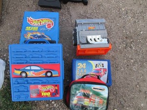Variety of Hot Wheels carrying cases and Matchbox lunch bag
