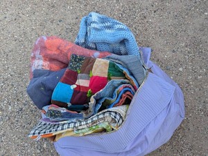 Bag of blankets, quilts and other bedding