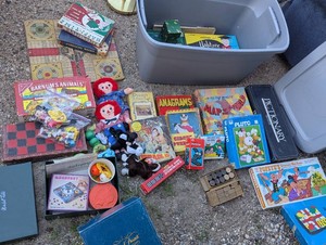 30-gallon tote loaded with vintage games, puzzles, Disney toys, beanie babys and Raggedy Ann n Andy dolls