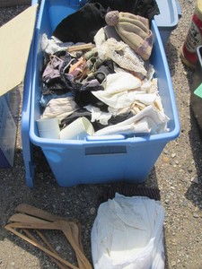 Large tote consisting of vintage clothing and hats