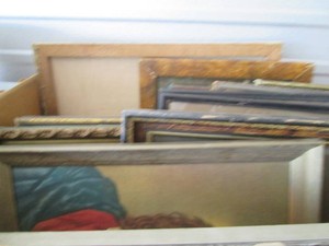 Box of vintage picture frames and misc wall decor