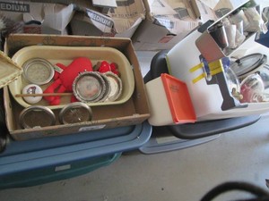 Box of assorted mini liquor bottles, shot glasses, pan lids and more