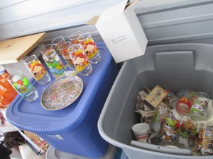 Tote full of assorted vintage McDonalds Muppets and Peanuts glasses, vintage advertisement mugs and Ceramic cookie jar