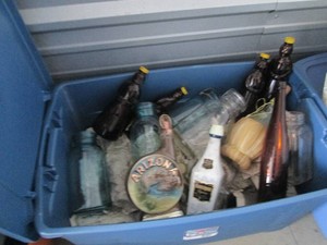 Large tote with vintage Decanters, amber glass syrup bottles, large canning jars and other glassware