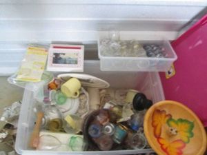 Covered Tote containing vintage small Uranium glass cups , small pink depression glasses, various shot glasses, glass cookware and more