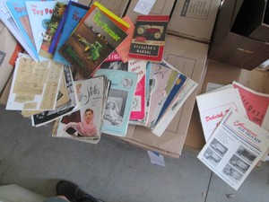 File box of vintage Toy truck salesman sample catalogs, design magazines and other related materials