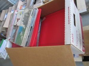 Box of nine 3-ring binders containing a massive variety of post cards from around the world