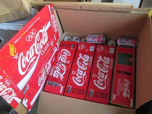Large box of vintage Coca-Cola and Pepsi cans both loose and with their respective cardboard packaging
