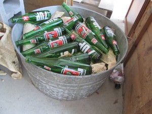 Large Metal wash bucket full of vintage glass soda bottles