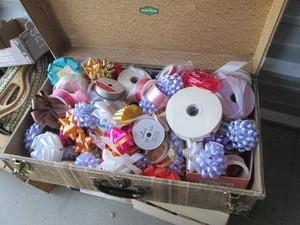 Vintage Suitcase full of assorted ribbon and gift bows