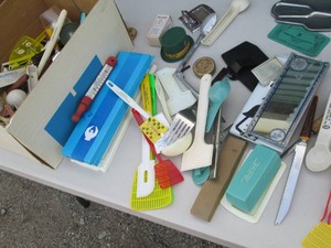 Box of vintage kitchen utensils, fly swatters and other products