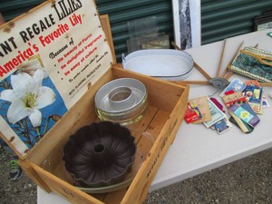 Wooden hinged crate with various metal and glass bakeware, sewing notions and other supplies