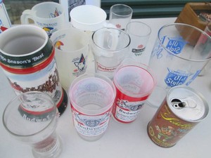 Budweiser Stein and glass cups, Bud Light mugs and assorted brand collectibles