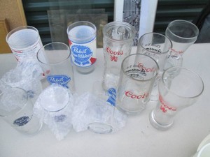 Collection of vintage Coors and Pabst Blue Ribbon mugs and glasses