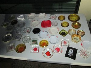 Collection of assorted vintage glass ashtrays including Coors, grain Belt, Gluek and more