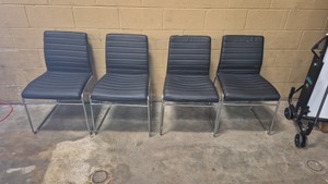 black ribbed faux-leather chairs